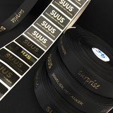 Promotieartikel lint Juwelier Suus zwart satijnen lint met goud glanzende bedrukking